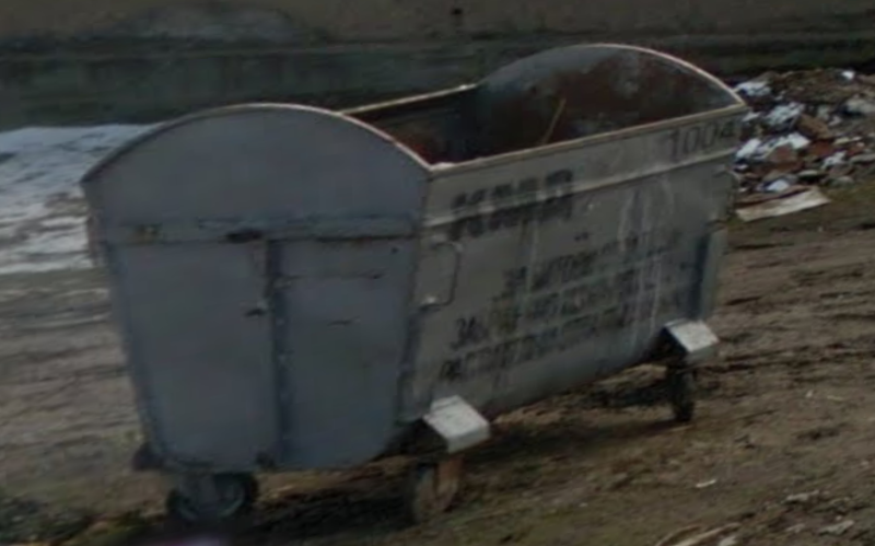 Zoomed in picture of dumpster with Cyrillic writing